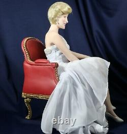 Franklin mint princess diana porcelain doll sitting in red chair