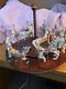 The Treasury Of Carousel Art With 10 Porcelain Figurines On A Wood Base