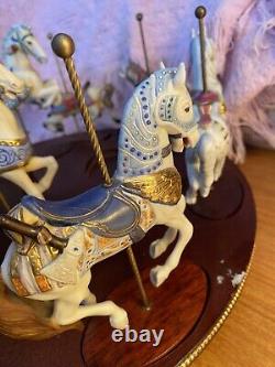 The Treasury Of Carousel Art With 10 Porcelain Figurines On A Wood Base