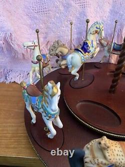The Treasury Of Carousel Art With 10 Porcelain Figurines On A Wood Base