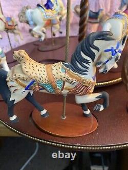 The Treasury Of Carousel Art With 10 Porcelain Figurines On A Wood Base