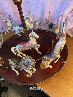 The Treasury Of Carousel Art With 10 Porcelain Figurines On A Wood Base